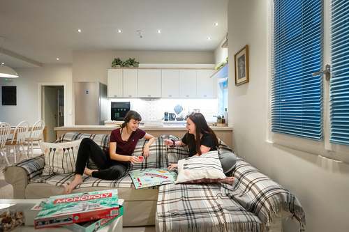 Children playing in the Kalamata Mediterranean Villas living room